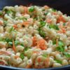 Creamy Hawaiian mac salad with carrots, onion, and green onion.