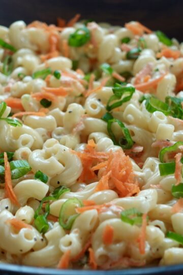 Creamy Hawaiian mac salad with carrots, onion, and green onion.
