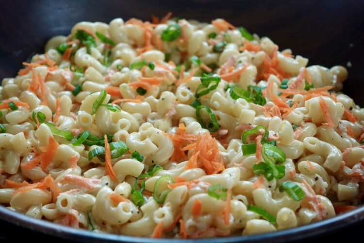 Creamy Hawaiian mac salad with carrots, onion, and green onion.