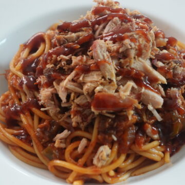 Memphis BBQ spaghetti made with chopped pulled pork in a smoky barbecue tomato sauce.