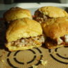 sausage and cheese cornbread biscuit breakfast sandwiches with honey butter glaze