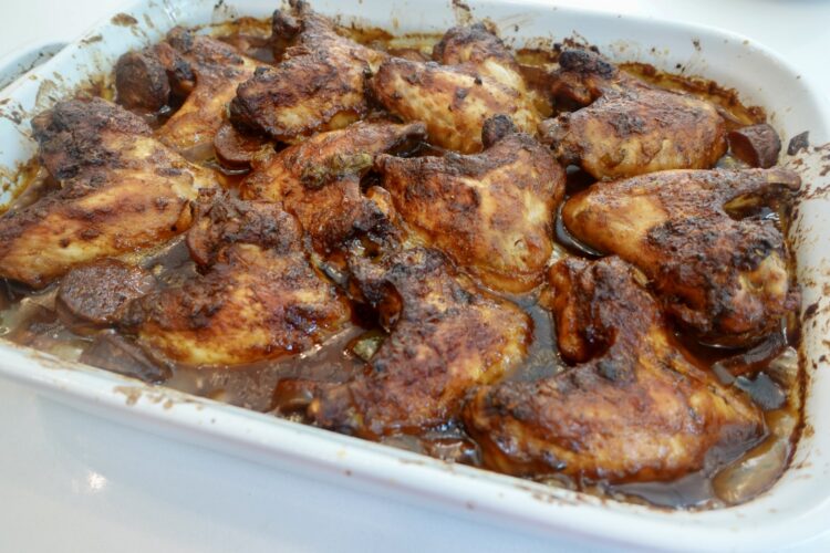Smothered gumbo wings with andouille sausage and rich gumbo gravy.