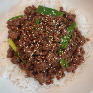 Spicy Mongolian ground beef with green onions served over jasmine rice.